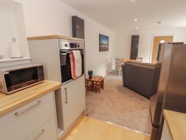 A kitchen with microwave and oven at Little Plumtree in Milnthorpe