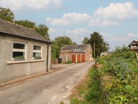 A house with a garage and garden at Little Plumtree in Milnthorpe