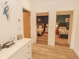 An entryway with two bedrooms visible at Blue Heron Lodge in Kirkby Stephen