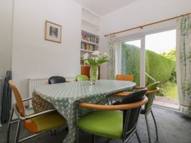 A dining room with a table and chairs at Gwynfa in Old Colwyn