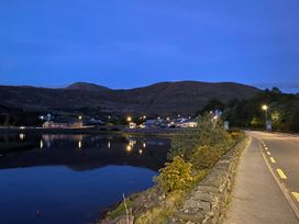A view of a village near a body of water at The Cottage in Leenane, County Galway