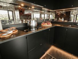 A kitchen with a sink and pots on the countertop at Hanowen House Dungloe, County Donegal