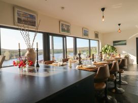 A dining room with a table set for meals at Hanowen House, Dungloe, County Donegal