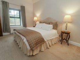 A bedroom with a bed and bedside table at Hanowen House Dungloe, County Donegal