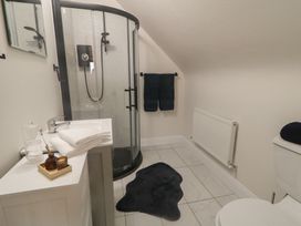 A bathroom with a shower and sink at Hanowen House in Dungloe, County Donegal