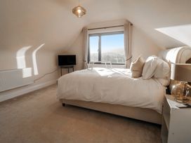 A bedroom with a bed and television at Hanowen House in Dungloe, County Donegal