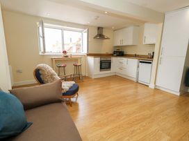 A kitchen with stove and sink at Flat 3