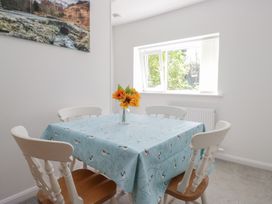 A dining room with a table and chairs at Fellfoot Cottage 
