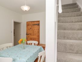 A dining room with a table and chairs at Fellfoot Cottage