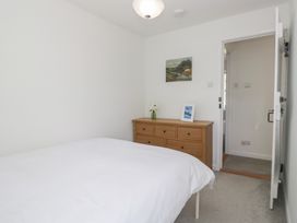 A bedroom with a bed and a chest of drawers at Fellfoot Cottage
