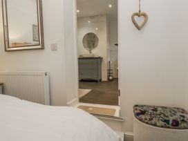 A bedroom with a view of a bathroom at The Dove Cot in Ambleside