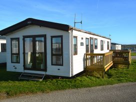 A static caravan with a veranda at 457 Pentreath View Perranporth
