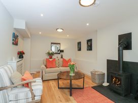 A living room with a coffee table and a fireplace at Paddock View in Stow-On-The-Wold