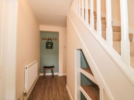 A hallway with staircase and bench at Ammerham Farm Cottage Ammerham near Winsham