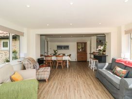 A living room with a dining area at Ammerham Farm Cottage in Ammerham near Winsham