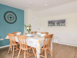 A dining room with a table and chairs at Ammerham Farm Cottage Ammerham near Winsham