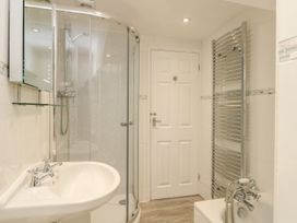 A bathroom with a shower and sink at Ocean Wave in Greenhill