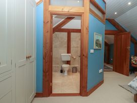 A bathroom with a toilet and sink at Pylemoor Cottage Washfield near Tiverton