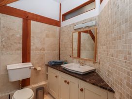 A bathroom with a toilet and sink at Pylemoor Cottage Washfield near Tiverton