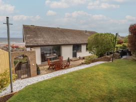 A house with a garden and patio at Tigh-Na-Mara Retreat