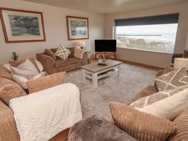 A living room with a sofa and television at Tigh-Na-Mara Retreat
