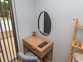 An office with a desk and mirror at Tigh-Na-Mara Retreat