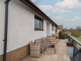 An outdoor area with seating and plants at Tigh-Na-Mara Retreat