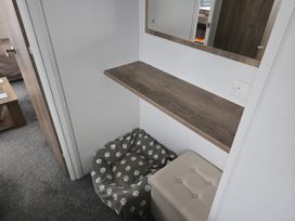 A table and storage box in a hallway at River Meadow 61 Northampton