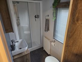 A bathroom with a shower and sink at River Meadow 61 Northampton