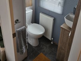 A bathroom with a toilet and sink at River Meadow 61 Northampton