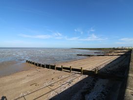A beach with groynes along the coastline at Ocean Breeze Escape in Allhallows