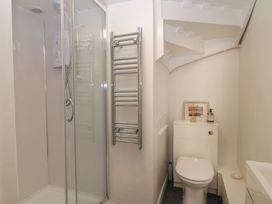 A bathroom with a shower and toilet at The Old Studio in Penzance