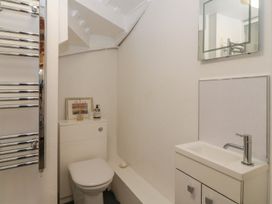 A bathroom with a sink and toilet at The Old Studio in Penzance