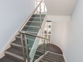 A staircase with a handrail and wall at Mill Wharf in Berwick-upon-Tweed