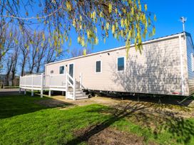 A mobile home with a deck and stairs at 0028 South Beach