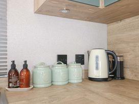 A kitchen with a kettle and canisters at 0028 South Beach