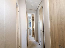 A hallway with doors on either side at 0028 South Beach