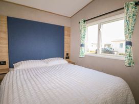 A bedroom with a bed and window at 0028 South Beach