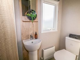 A bathroom with a sink and toilet at 0028 South Beach