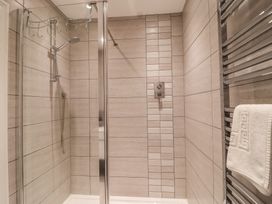 A shower area with towel rail and shower control at 3 The Elms in Salcombe