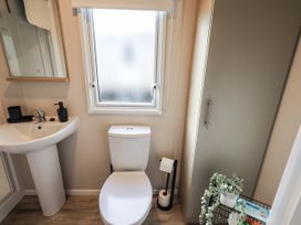 A bathroom with a sink and toilet at Hadrian's Rest in Wigton
