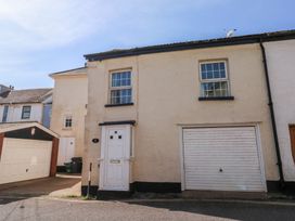 A house with a door and garage at The Cottage in Budleigh Salterton