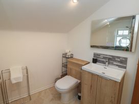 A bathroom with a toilet and sink at The Cottage Budleigh Salterton
