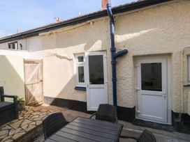 An outdoor area with doors and a stone floor at The Cottage Budleigh Salterton