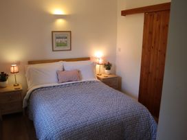 A bedroom with a bed and bedside tables at Castle Rag in Parkend