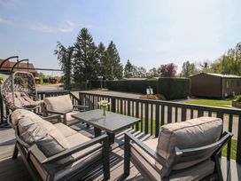 An outdoor seating area with a table and chairs at Tulip in Eardisland