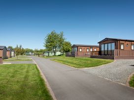 A view of cabins and a road in a recreational park at Tulip in Eardisland