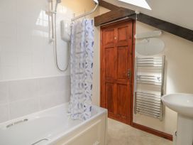 A bathroom with a shower and bath at Applestore in Wadebridge
