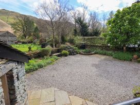 A garden with gravel and trees at Beckside Studio in Penrith