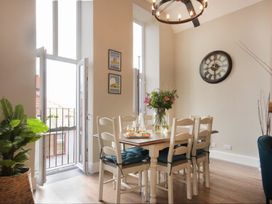 A dining room with a table and chairs at Juniper Cottage